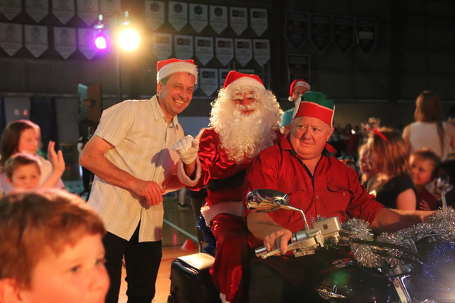 Principal David Mezinec with special guest Santa arriving in style this year!.JPG